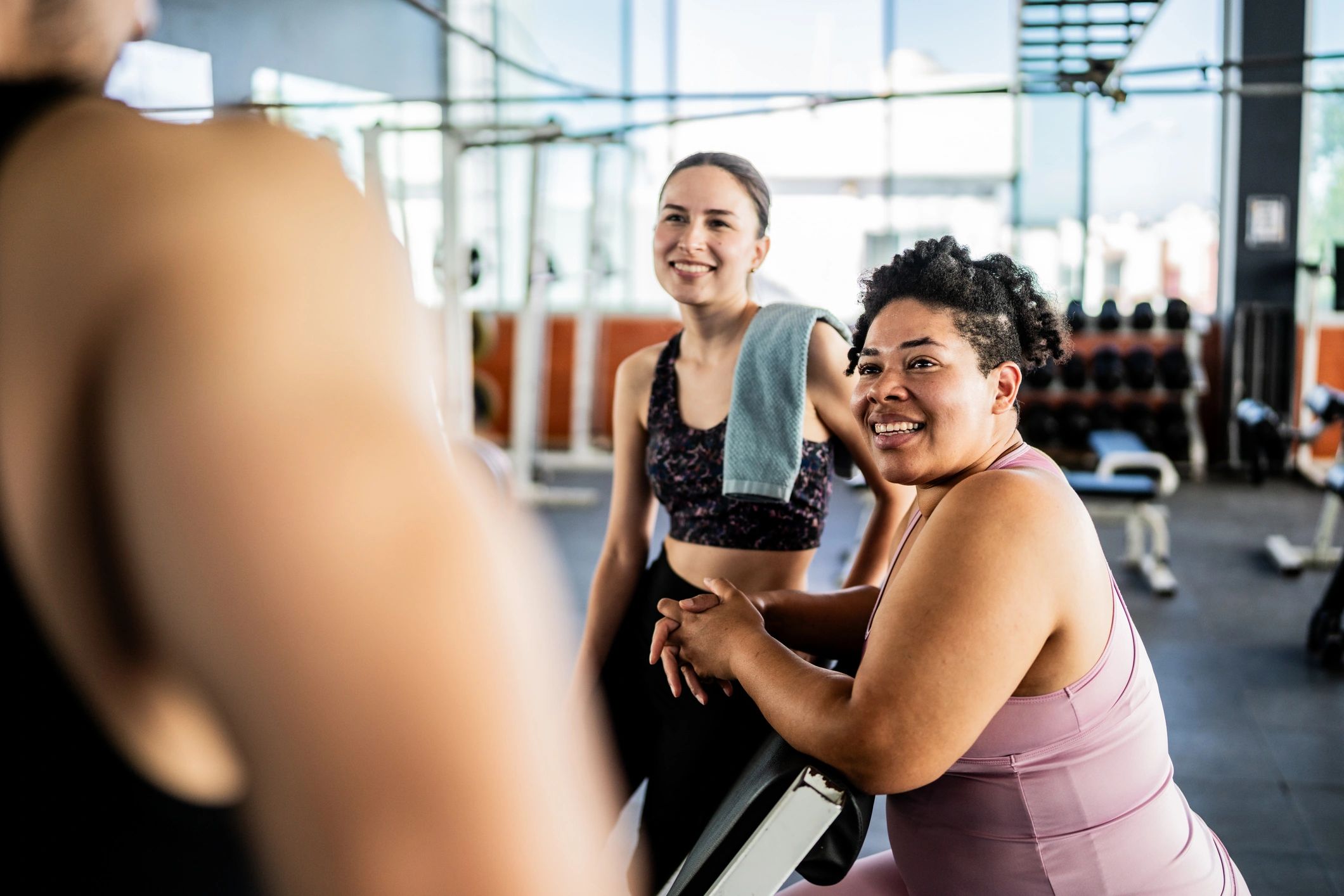 Women connecting in a gym after class